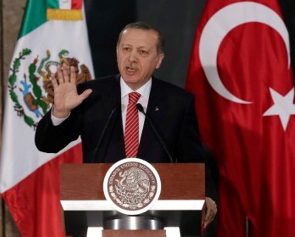 Turkey's President Tayyip Erdogan gives a speech to the media next to Mexico's President Enrique Pena Nieto (not pictured) during an official welcoming ceremony for Erdogan, at the National Palace in Mexico City February 12, 2015. Erdogan is in Mexico on an official two-day visit. REUTERS/Henry Romero (MEXICO - Tags: POLITICS)